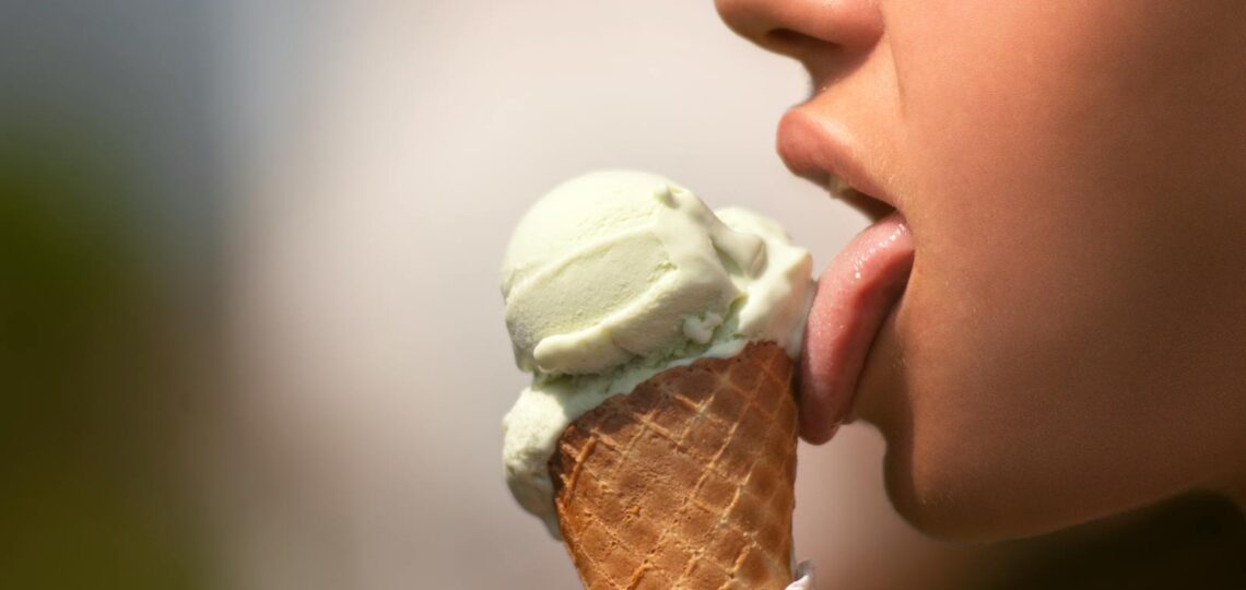 Woman Licking Ice Cream