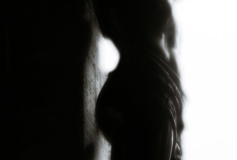 Silhouette of a Shirtless Woman